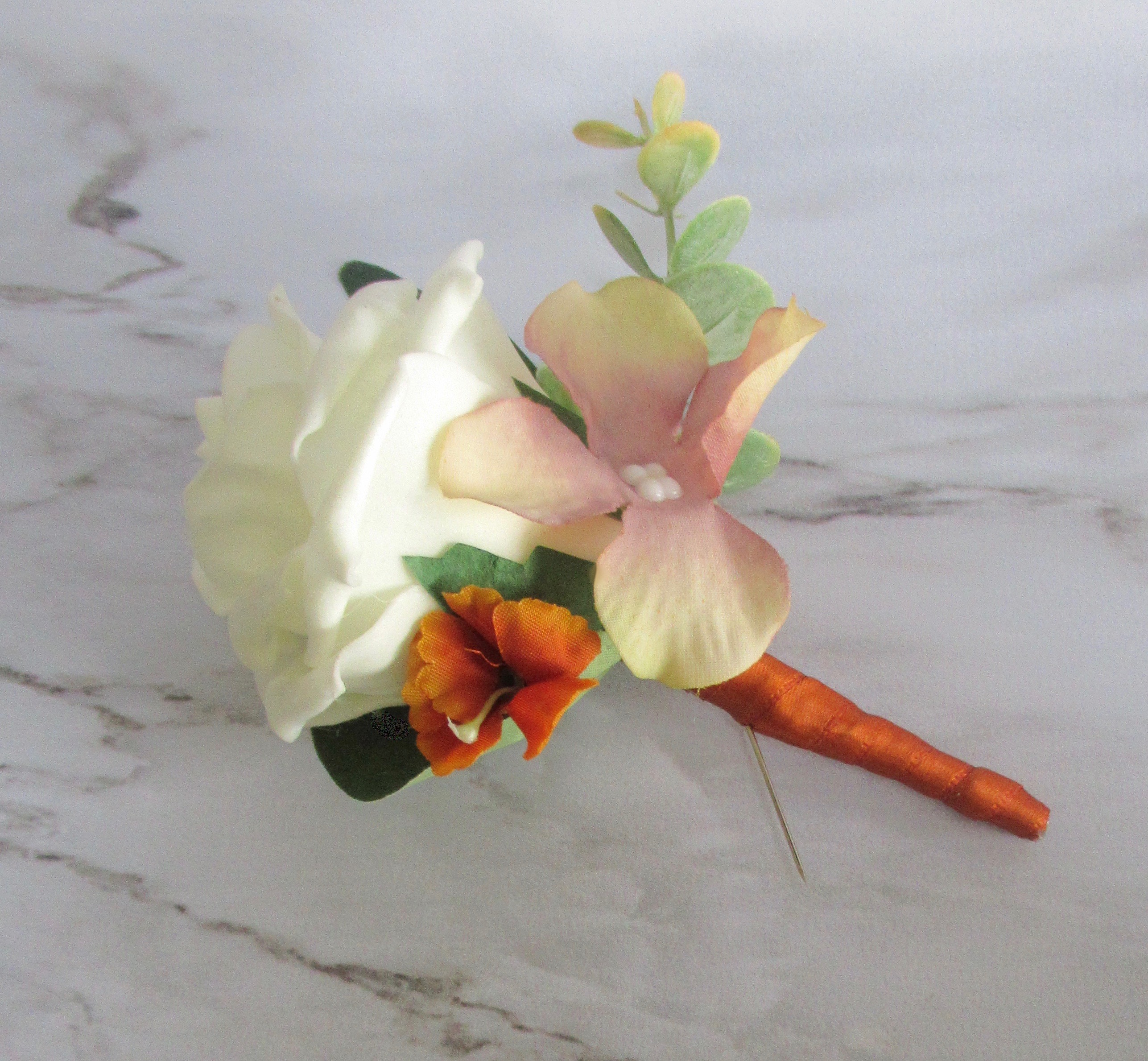 burnt orange buttonhole